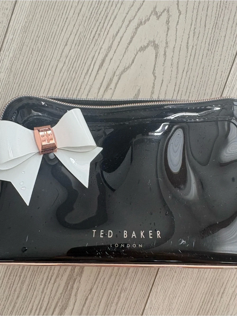 Ted Baker Black Patent Cosmetic Pouch with White Bow and Rose Gold Trim